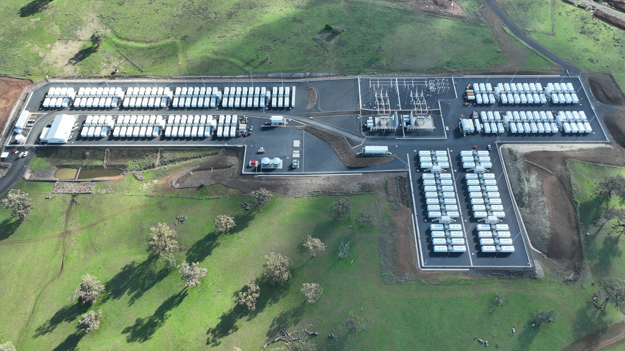 Aerial view of the Orana BESS site with battery units and grid infrastructure.